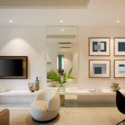 black flat screen tv on white wooden tv rack